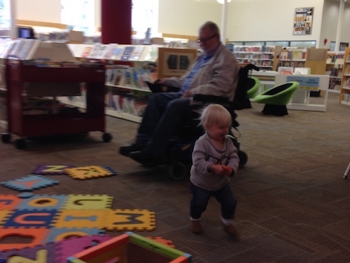 Toddler running from Grandpa